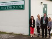 Woodland: From left: Stacy Brown, Woodland Public Schools’ business services manager, Jillian Jacobs, TEAM High School teacher, Jake Hall, executive director of learning supports and alternatives, and Stacie Crochet, local mental health provider, stand outside TEAM High School, where students can now access free mental health services thanks to federal funding.