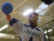 Natalie Behring/for The Columbian Goalball player John Hinman - who lives in Vancouver and plays for the Portland Avalanche - prepares to hurl a goalball during a practice session in the Kennedy Fitness Center at the Washington State School for the Blind. The Northwest Association for Blind Athletes hosted a skills clinic and scrimmage with the Tacoma Typhoon on Saturday afternoon.