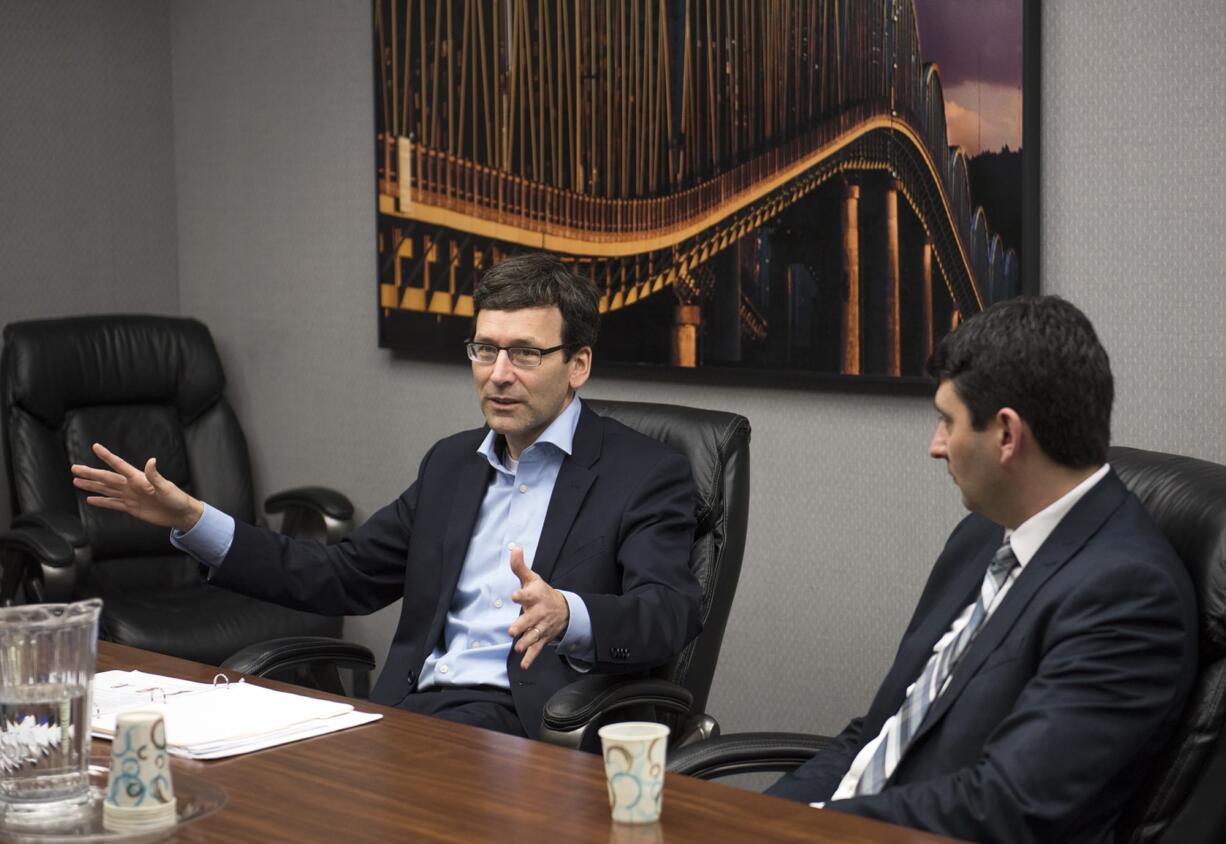 Washington Attorney General Bob Ferguson, left, and Washington Chief Deputy Attorney General Shane Esquibel, right, meet with the Columbian Editorial Board on Wednesday morning, Jan. 31, 2018.