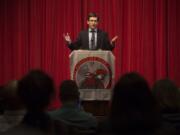 Washington Attorney General Bob Ferguson addresses a receptive crowd at Fort Vancouver High School on Tuesday night.