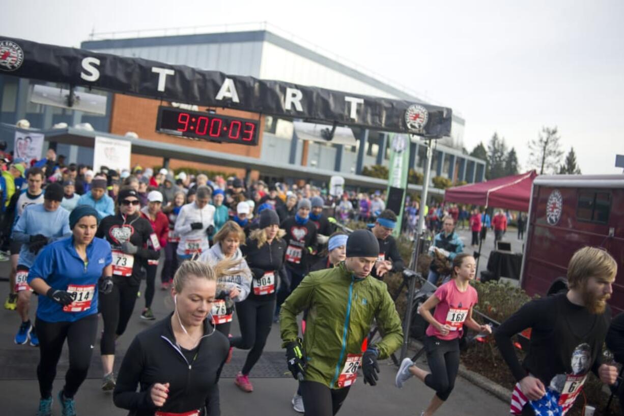 Runners start the 10k race during Clark Public Utilities’ annual Race for Warmth in 2017. The run raises money to help people struggling to pay their heating bills.