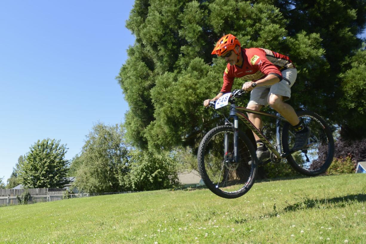 Ed Fischer, owner of Camas Bike and Sport, rides his bike through Hamllik Park in Washougal in 2016. Plans to open Phase II of the bike park that opened with Phase I in October have been put on hold.