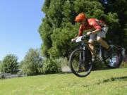 Ed Fischer, owner of Camas Bike and Sport, rides his bike through Hamllik Park in Washougal in 2016. Plans to open Phase II of the bike park that opened with Phase I in October have been put on hold.