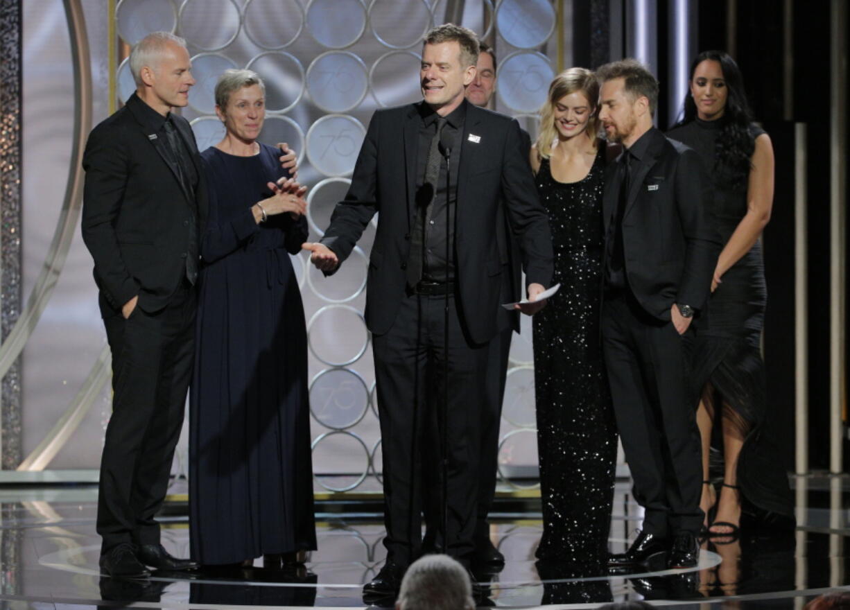 Producer Graham Broadbent, center, accepting the award for best motion picture drama for “Three Billboards Outside Ebbing, Missouri,” at the 75th Annual Golden Globe Awards in Beverly Hills, Calif., on Sunday.