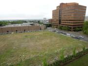 The empty lot south of the Vancouver Community Library was originally to be a parking garage as part of the Library Square development. New plans indicate the space will be a school.