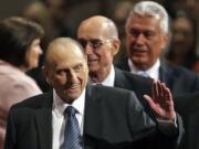 President Thomas S. Monson, of The Church of Jesus Christ of Latter-day Saints, waves to the audience during the opening session of the Mormon church conference in Salt Lake City in 2015. Monson, the 16th president of the Mormon church, died after nine years in office. He was 90.