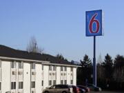 A Motel 6 motel is seen Wednesday, Jan. 3, 2018, in SeaTac, Wash. Washington's attorney general is suing Motel 6, saying the budget hotel disclosed the personal information of thousands of guests to federal immigration authorities in violation of state law. Attorney General Bob Ferguson said at a news conference Wednesday that the motel divulged to the U.S. Immigration and Customs Enforcement the names, dates of birth, license plate numbers and room numbers of more than 9,000 guests at six locations throughout the state.