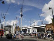 Soccer fans arrive for a match between Tottenham Hotspur and Manchester United as cranes being used for construction work are seen at White Hart Lane stadium in London. The Oakland Raiders will host the Seattle Seahawks in the first NFL game at the new London stadium of English Premier League club Tottenham. The game will be played in Week 6 of the NFL season on Oct. 14.