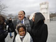 Martin Luther King III,with his wife Arndrea Waters, and their daughter Yolanda, 9, during their visit to the Martin Luther King Jr., Memorial on the National Mall in Washington, Monday, Jan. 15, 2018. The son of the late U.S.