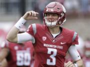 FILE - In this Sept. 17, 2016 file photo, Washington State quarterback Tyler Hilinski (3) runs onto the field with his teammates before an NCAA college football game against Idaho in Pullman, Wash. Hilinski has died from an apparent self-inflicted gunshot wound. The 21-year-old Hilinski was discovered in his apartment after he didn’t show up for practice Tuesday, Jan. 16, 2018.