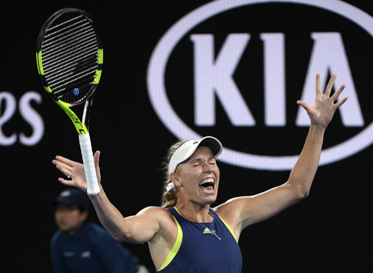 Denmark's Caroline Wozniacki celebrates after defeating Romania's Simona Halep during the women's singles final at the Australian Open tennis championships in Melbourne, Australia, Saturday, Jan. 27, 2018.