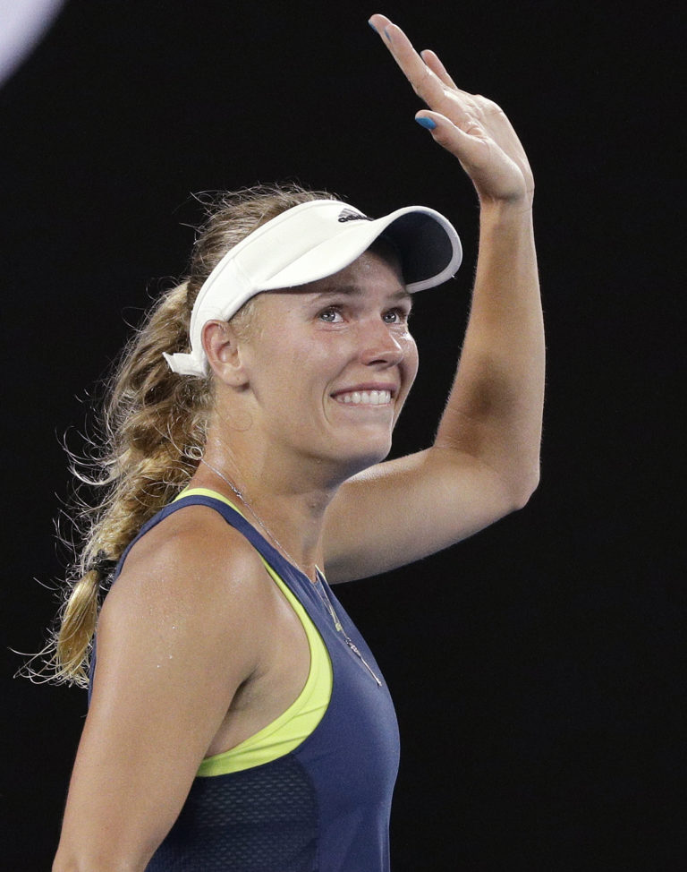 Denmark's Caroline Wozniacki celebrates after defeating Romania's Simona Halep in the women's singles final at the Australian Open tennis championships in Melbourne, Australia, Saturday, Jan. 27, 2018.