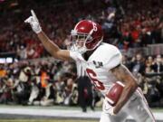 Alabama wide receiver DeVonta Smith (6) celebrates his touchdown during overtime of the NCAA college football playoff championship game against Georgia, Monday, Jan. 8, 2018, in Atlanta. Alabama won 26-23 in overtime.