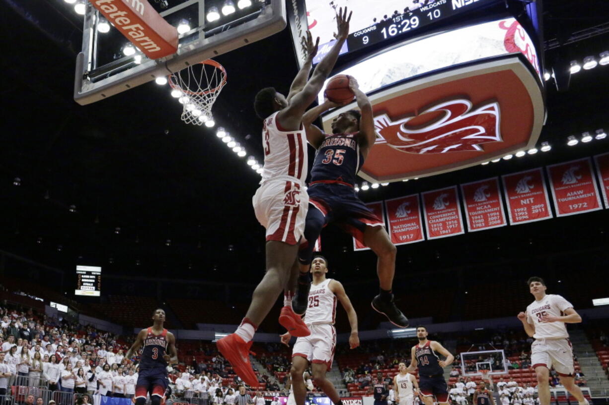 Arizona guard Allonzo Trier (35) shoots against Washington State forward Robert Franks (3) during the first half of an NCAA college basketball game in Pullman, Wash., Wednesday, Jan. 31, 2018.