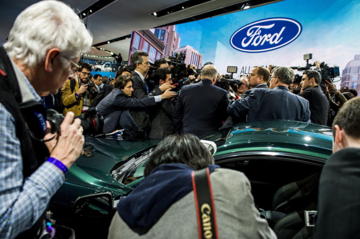 Members of the media interview Jim Hackett, President and CEO of Ford Motor Company in front of Ford’s new 2019 Mustang Bullitt at the North American International Auto Show, Sunday, Jan. 14, 2018, in Detroit.