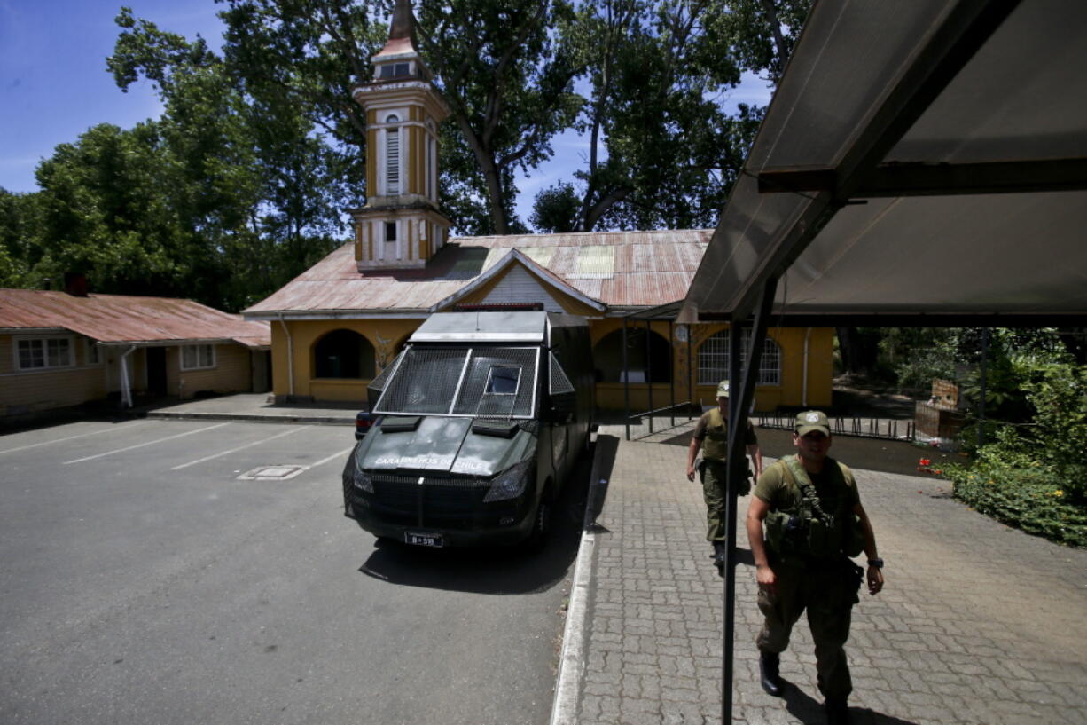 Police guard the Santuario de la Virgen del Transito in Temuco, Chile. While the vast majority of Chile’s estimated 1 million citizens of Mapuche descent oppose using violence, a small number use it to push their agenda. In recent years scores of churches have been among the targets.