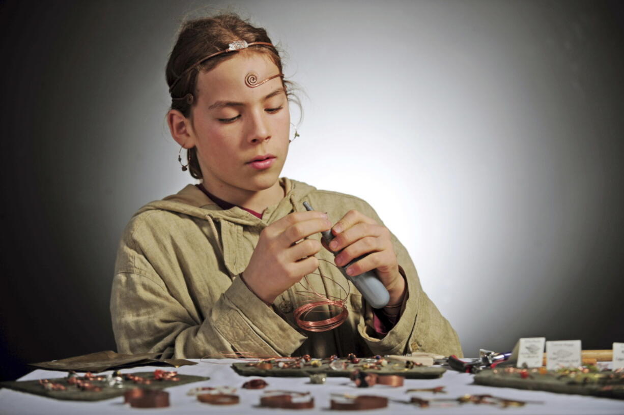 Simon Gomez, 12, demonstrates his jewelry-making technique Dec. 28 in Mount Vernon. Gomez’s work is being sold at the Skagit Valley Food Co-op. He has been making jewelry since he was 6 years old.