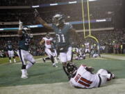 Philadelphia Eagles’ Jalen Mills (31) and Brandon Graham (55) celebrate after Atlanta Falcons’ Julio Jones (11) cannot catch a fourth down pass during the second half of an NFL divisional playoff football game, Saturday, Jan. 13, 2018, in Philadelphia. Philadelphia won 15-10.