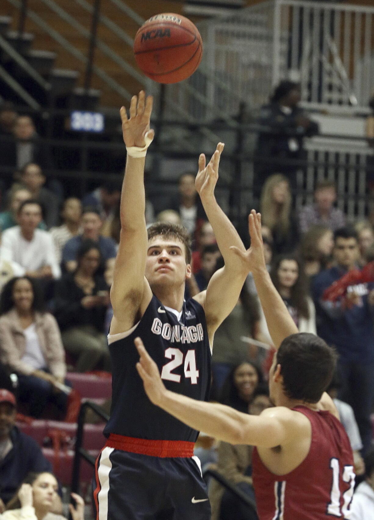 Gonzaga forward Korey Kispert (24) shoots as Loyola Marymount guard/forward Steve Haney (12) defends in the first half of an NCAA college basketball game in in Los Angeles, Saturday, Jan. 6, 2018.