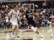 Gonzaga guard Zach Norvell Jr. (23) dribbles next to Santa Clara guard Matt Hauser (12) during the second half of an NCAA college basketball game Saturday, Jan. 20, 2018, in Santa Clara, Calif.