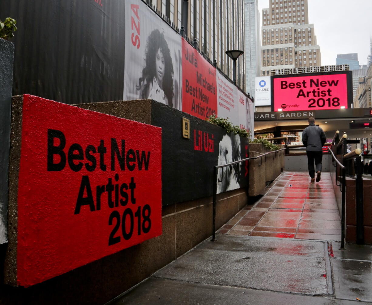 Signs posted around Madison Square Garden promote the return of the Grammy Awards to New York on Tuesday in New York. The Grammy Awards will be held on Sunday.