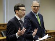 Washington Attorney General Bob Ferguson, left, talks to reporters as Washington Gov. Jay Inslee looks on Jan. 4 at the Capitol in Olympia. Ferguson is among the state attorneys general who signed the petition to bring back net neutrality. (AP Photo/Ted S.