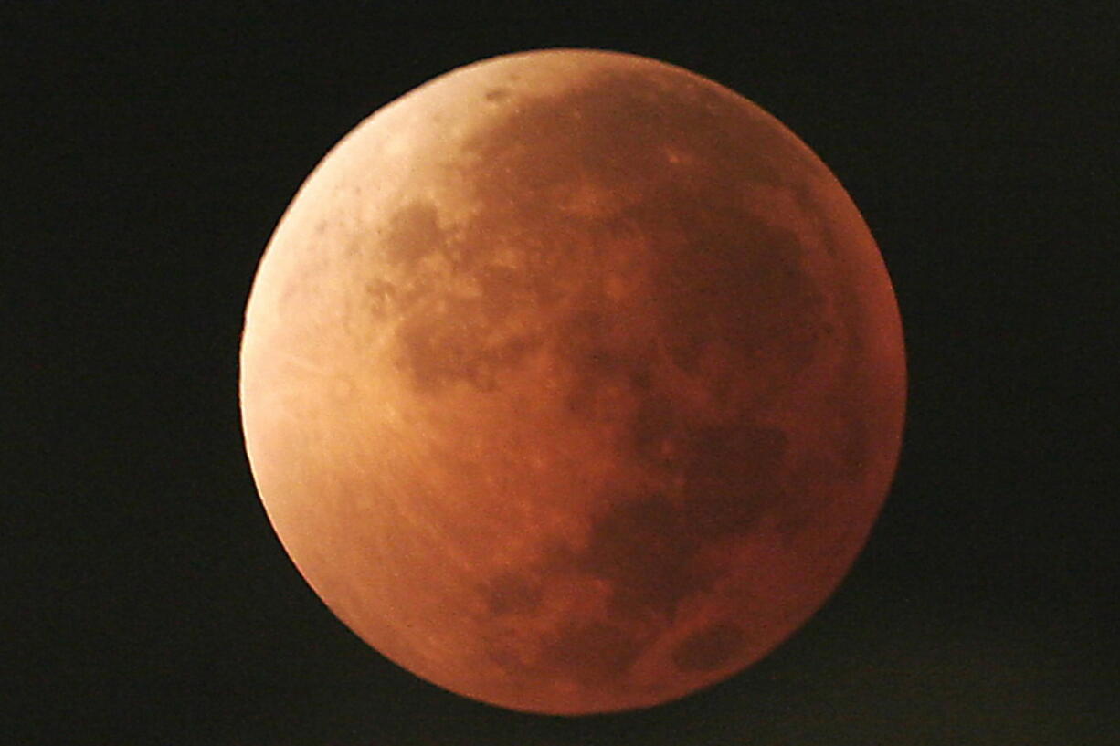 The moon takes on different orange tones during a lunar eclipse seen from Mexico City. During a lunar eclipse, the moon’s disk can take on a colorful appearance from bright orange to blood red to dark brown and, rarely, very dark gray. On Wednesday, Jan. 31, 2018, a super moon, blue moon and a lunar eclipse will coincide for first time since 1982 and will not occur again until 2037.