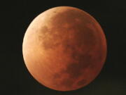 The moon takes on different orange tones during a lunar eclipse seen from Mexico City. During a lunar eclipse, the moon’s disk can take on a colorful appearance from bright orange to blood red to dark brown and, rarely, very dark gray. On Wednesday, Jan. 31, 2018, a super moon, blue moon and a lunar eclipse will coincide for first time since 1982 and will not occur again until 2037.