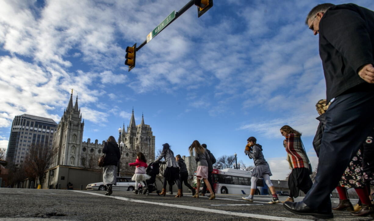 Mourners cross North Temple after paying their last respects to Thomas S. Monson, President of The Church of Jesus Christ of Latter-day Saints, during a public viewing at the LDS Conference Center in Salt Lake City, Utah, Thursday, Jan. 11, 2018. Monson spent more than five decades serving in top church leadership councils, making him a well-known face and personality to multiple generations of Mormons. He died on Jan. 2 at the age of 90.