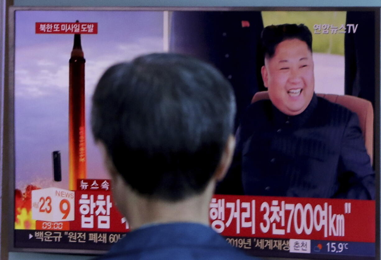 A man watches a TV screen Sept. 15 showing a file footage of North Korea’s missile launch and North Korean leader Kim Jong Un, at the Seoul Railway Station in Seoul, South Korea.