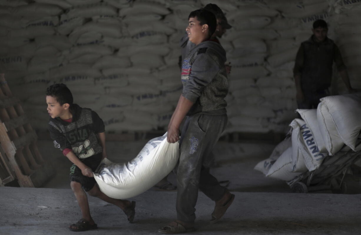 Palestinians receive food aid at a U.N. warehouse in the Shati refugee camp, Gaza City. From the Gaza Strip to Jordan and Lebanon, millions of Palestinians are bracing for the worst as the Trump administration moves toward cutting funding to the U.N. agency that assists Palestinian refugees across the region. The expected cuts could deliver a painful blow to some of the weakest populations in the Middle East and risk destabilizing the already struggling countries that host displaced Palestinian refugees and their descendants.