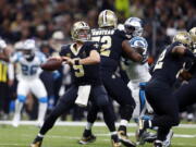 New Orleans Saints quarterback Drew Brees (9) passes in the first half of an NFL football game against the Carolina Panthers in New Orleans, Sunday, Jan. 7, 2018.