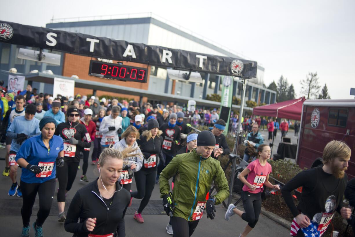 Runners start the 10k race during Clark Public Utilities' annual Race for Warmth in Vancouver on Sunday, Jan. 29, 2017. The fun-run raises money to help people struggling to pay their electric bills. The 2018 run is scheduled for Jan. 28.