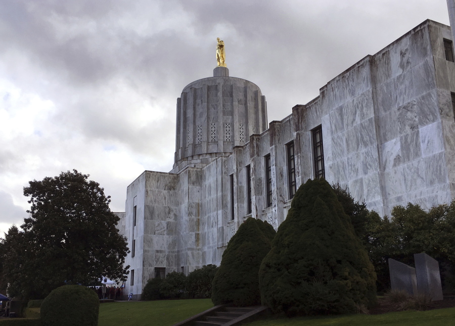 Dark clouds hover over the Capitol in Salem, Ore., Thursday, Jan. 11, 2018. The intense national focus on sexual misconduct came to Oregon's capital this week, when lawmakers were given a training session on harassment and how to report it.