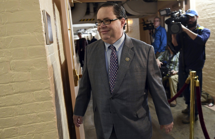 FILE - In this Dec. 19, 2017, file photo, Rep. Blake Farenthold, R-Texas, arrives for a meeting of House Republicans on Capitol Hill in Washington. The Treasury Department has paid out almost $300,000 in taxpayer funds to settle claims brought against Congressional offices that include sexual harassment and sex discrimination since 2003. One of those settlements, for $84,000, stemmed from a 2014 lawsuit brought against Farenthold by his former communications director. Farenthold denied the allegations. But after the settlement was revealed late last year Farenthold pledged to pay the money back.