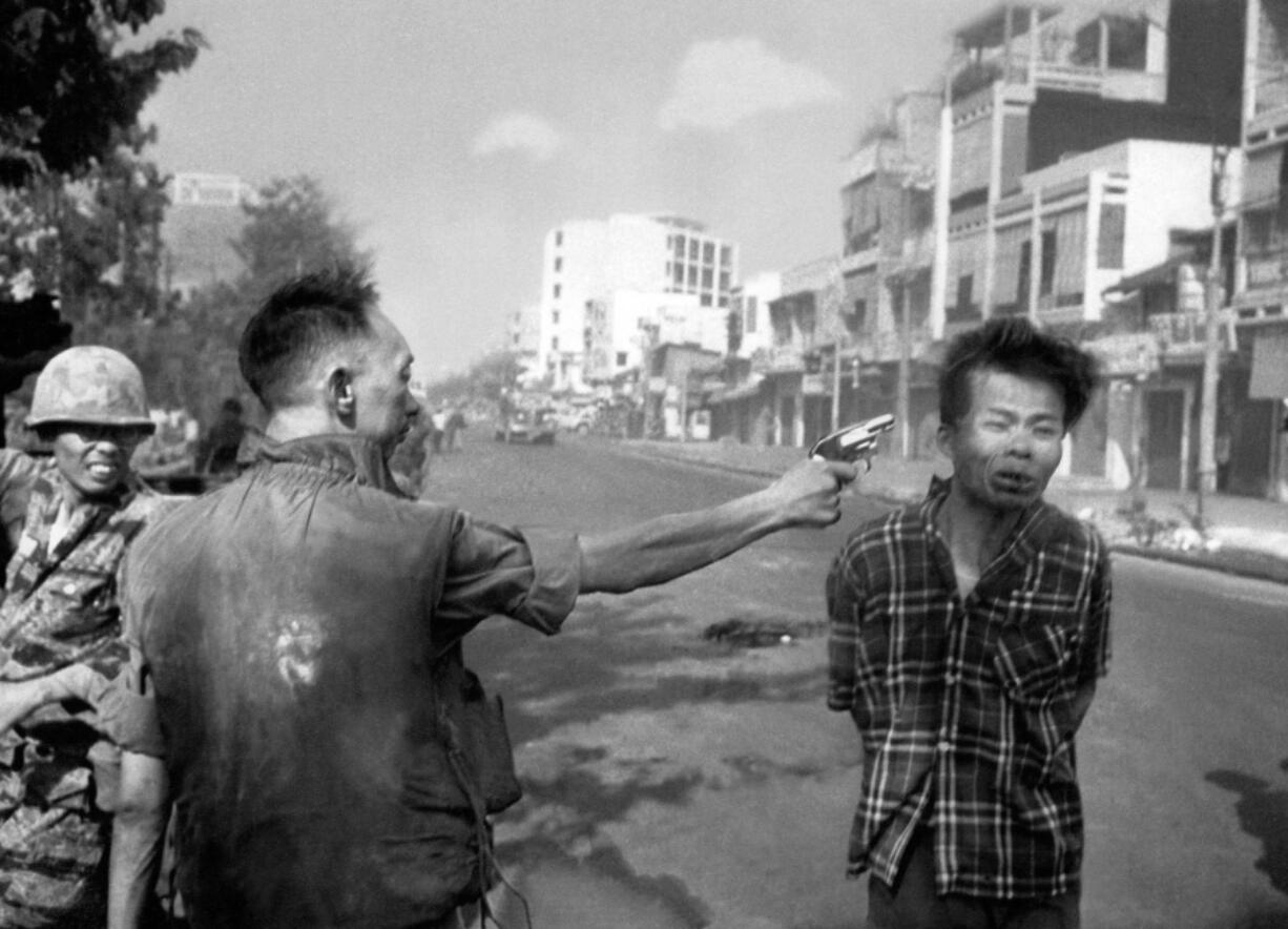 South Vietnamese Gen. Nguyen Ngoc Loan, chief of the National Police, fires his pistol into the head of suspected Viet Cong officer Nguyen Van Lem (also known as Bay Lop) on a Saigon street, Feb. 1, 1968 early in the Tet Offensive. The photo showed the war’s brutality in a way Americans hadn’t seen before. Protesters saw it as graphic evidence that the U.S. was fighting on the side of an unjust government.