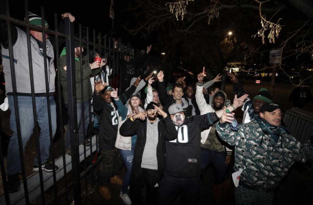 Fans celebrate outside Lincoln Financial Field after the NFL football NFC championship game between the Philadelphia Eagles and the Minnesota Vikings on Sunday in Philadelphia. The Eagles won 38-7 to advance to Super Bowl LII.