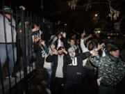 Fans celebrate outside Lincoln Financial Field after the NFL football NFC championship game between the Philadelphia Eagles and the Minnesota Vikings on Sunday in Philadelphia. The Eagles won 38-7 to advance to Super Bowl LII.