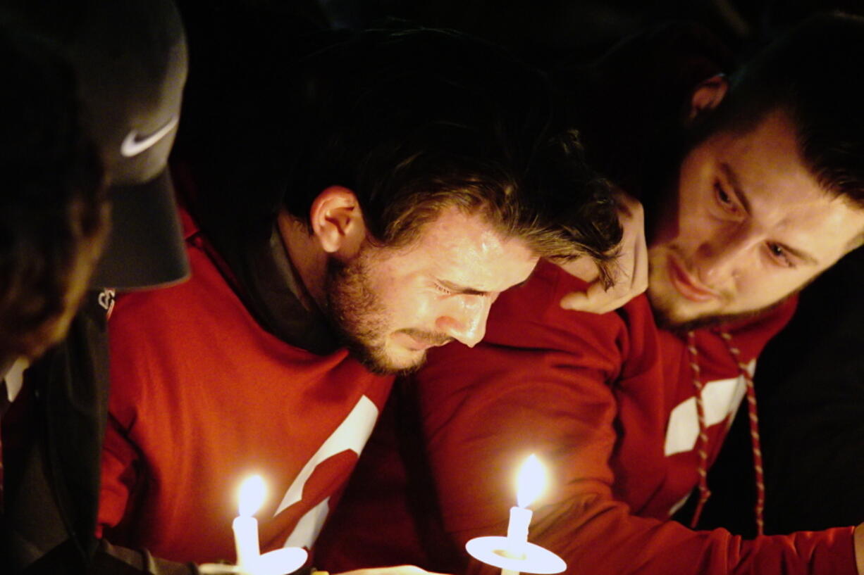 Washington State quarterback Luke Falk cries during a candlelight memorial service for fellow quarterback Tyler Hilinski, Friday, Jan. 19, 2018, in Pullman, Wash. Hilinski, a sophomore, committed suicide earlier in the week.