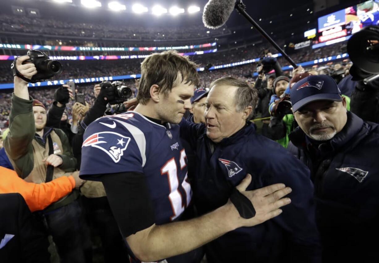 New England Patriots quarterback Tom Brady, left, hugs coach Bill Belichick after the AFC championship NFL football game against the Jacksonville Jaguars, Sunday, Jan. 21, 2018, in Foxborough, Mass. The Patriots won 24-20. (AP Photo/David J.