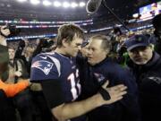 New England Patriots quarterback Tom Brady, left, hugs coach Bill Belichick after the AFC championship NFL football game against the Jacksonville Jaguars, Sunday, Jan. 21, 2018, in Foxborough, Mass. The Patriots won 24-20. (AP Photo/David J.