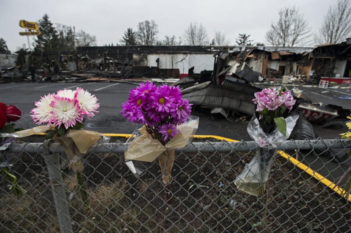 A memorial to homicide victim Amy Marie Hooser lines a fence at the Sifton Market site on Jan. 20, 2017.