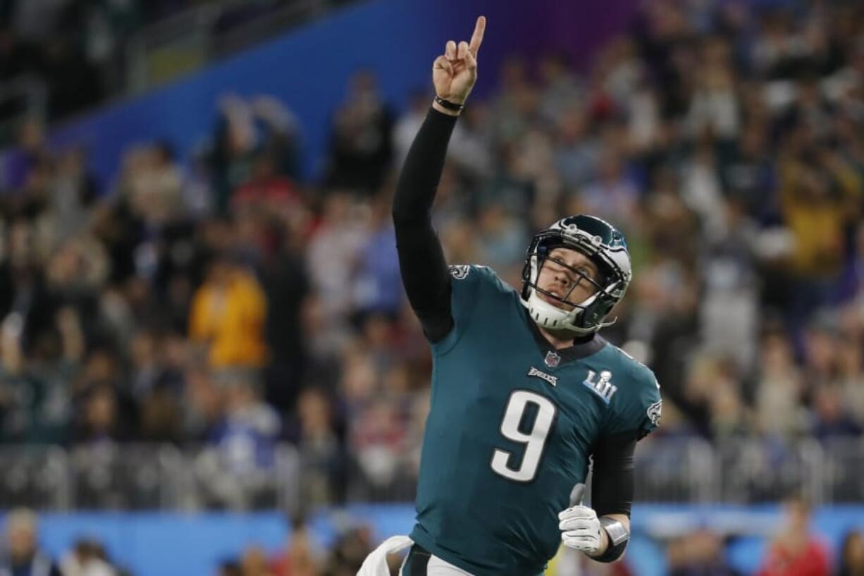 Philadelphia Eagles quarterback Nick Foles gestures after throwing a touchdown pass to wide receiver Alshon Jeffery on Sunday during the first half of the Super Bowl against the New England Patriots.