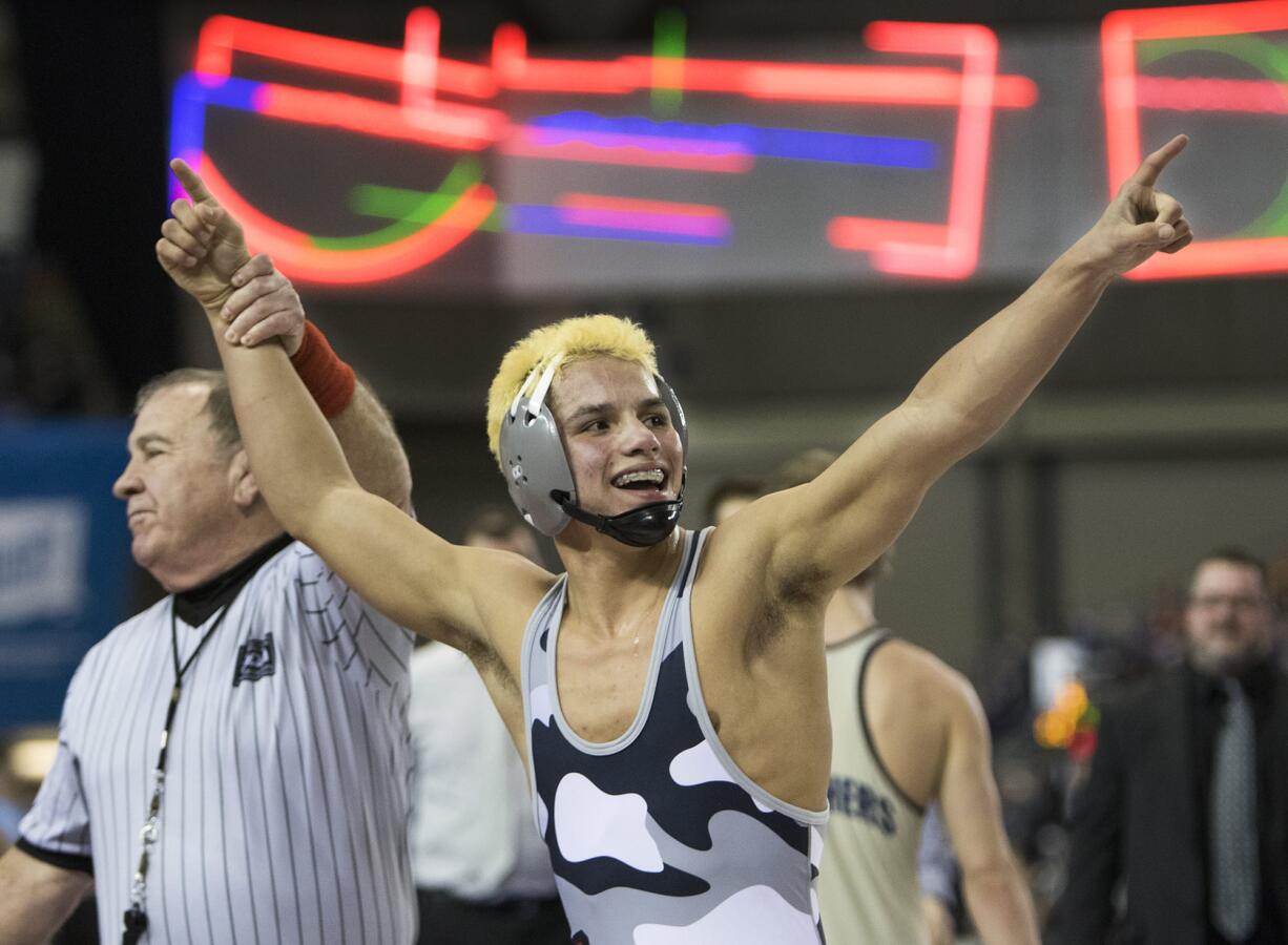 Union's Danny Snediker salutes the crowd after defeating Mead's Cameron Crawford in their 152-pound championship match at the 4A State Wrestling Tournament Saturday, Feb. 17, 2018, at the Tacoma Dome in Tacoma, Wash. Snediker won the match 8-4.