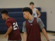 King's Way guard Khalfani Cason tracks a player on defense during the Knights' practice on Monday Feb.