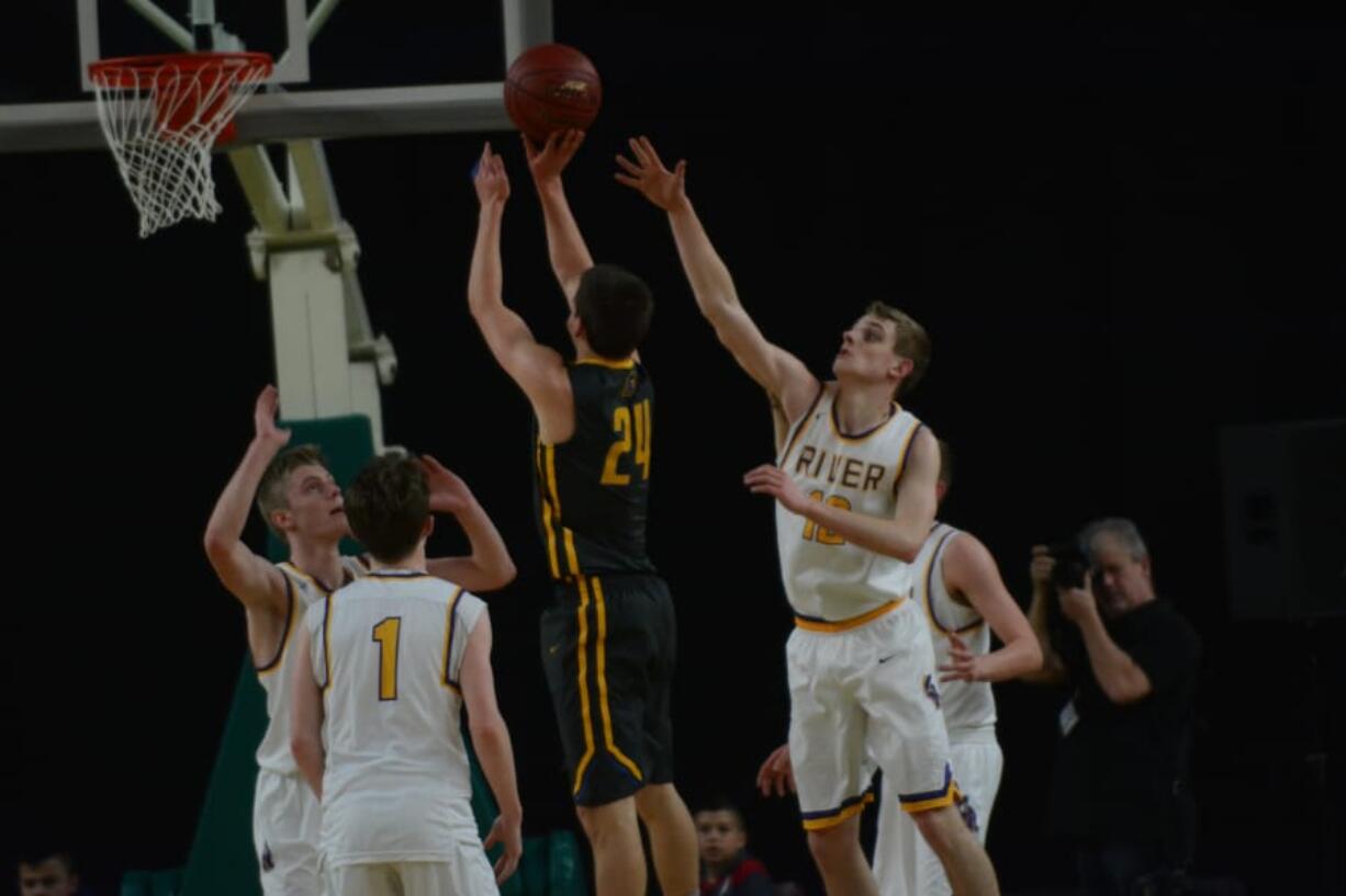 Columbia River’s Jack Anderson (left), Nate Snook (1) and Jacob Hjort (12) defend Fife’s Bryson Williams.