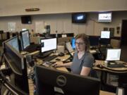 Dispatch supervisor Jodi Gaylord of Vancouver takes calls at Clark Regional Emergency Services Agency in downtown Vancouver. Gaylord said she listens for clues during calls that human trafficking may be taking place so she can alert officers responding to the scene.