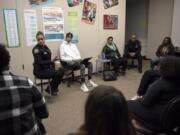 Portland Police Chief Danielle Outlaw talks with a group of Evergreen High School students during a Black Students United club meeting Thursday afternoon at the Vancouver school. The club launched this year in an effort to build unity at the predominantly white school.