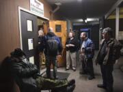 Men gather in the courtyard with volunteers at St. Paul Lutheran Church, one of two Lutheran churches in Vancouver that hosts the Winter Hospitality Overflow shelter program. Lutheran churches have a strong local presence in sheltering homeless people.