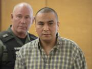 Ricardo Gutierrez Jr., in plaid, prepares to exit the courtroom after being found guilty of first-degree murder in the beating death of Jose "Pepe" Castillo-Cisneros, 3, with an aggravating factor that Pepe was a particularly vulnerable victim, in Clark County Superior Court on Thursday morning, Feb. 1, 2018. Gutierrez was sentenced Tuesday to 45 years in prison.